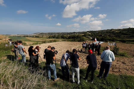 Activists gather at the site where anti-corruption journalist Daphne Caruana Galizia was assassinated in a car bomb one year ago, in Bidnija, Malta October 16, 2018. REUTERS/Darrin Zammit Lupi