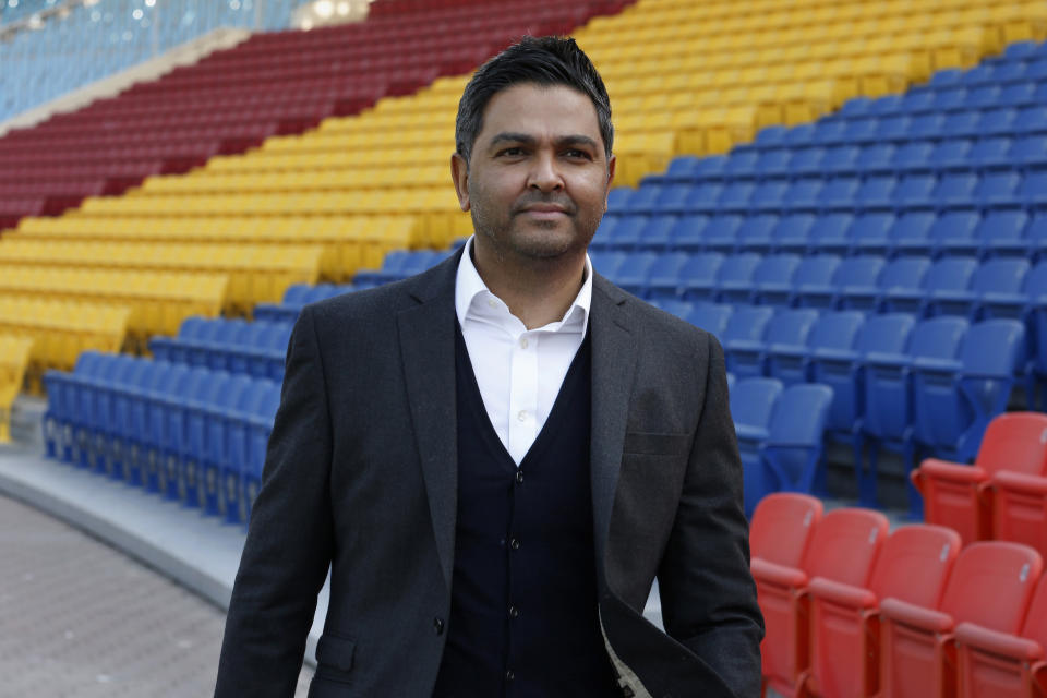 In this Nov. 20, 2020, photo, Chief Executive of the Pakistan Cricket Board Wasim Khan poses for a photo after an interview with The Associated Press, at Gaddafi stadium in Lahore, Pakistan. Pakistan is ready to host major cricketing nations like South Africa, New Zealand, England and West Indies in 2021 after seeing only the sport's lesser-lights in the past five years. "We're working hugely in terms of building relationships, nurturing those relationships with (other) cricket boards," Khan told The Associated Press. (AP Photo/K.M. Chaudary)