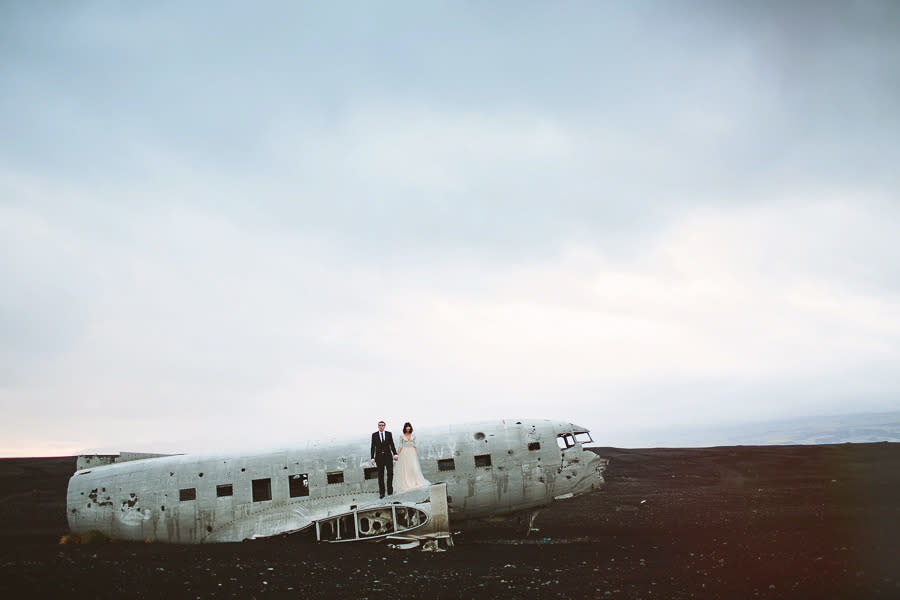 Rose and Nate pose atop the downed plane.