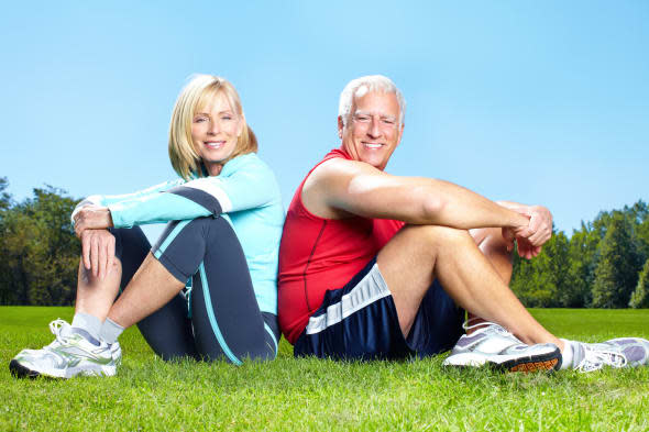 Senior healthy fitness couple. In the park.