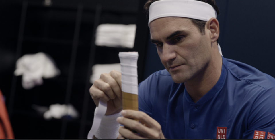 Roger Federer tending to his racquet in the documentary 