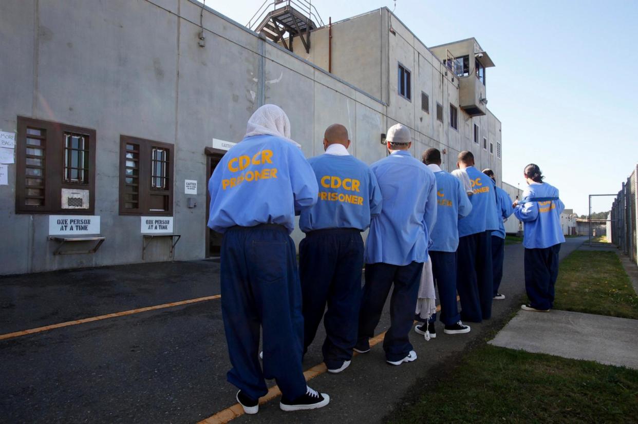 PHOTO: In this Oct. 13, 2012, file photo, Pelican Bay State Prison inmates stand in the yard as they move from one spot to another during an exercise period in Crescent City, Calif. (Mark Boster/Los Angeles Times via Getty Images, FILE)