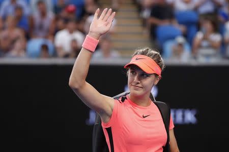 Tennis - Australian Open - Margaret Court Arena, Melbourne, Australia, January 18, 2018. Canada's Eugenie Bouchard waves after losing her match against Romania's Simona Halep. REUTERS/Issei Kato