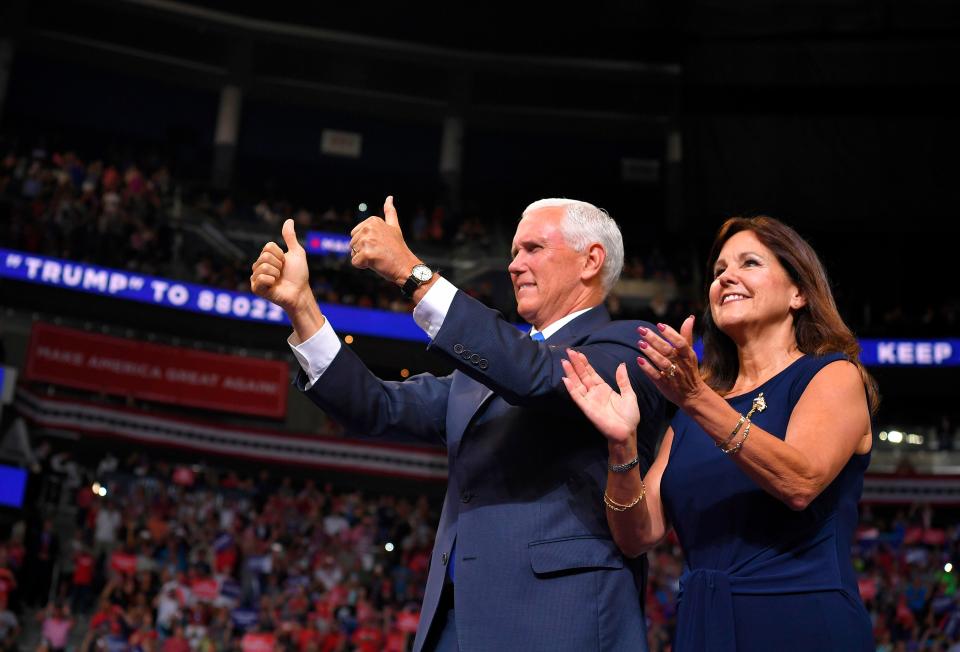 Vice President Mike Pence and his wife Karen Pence arrive at a rally for President Trump.