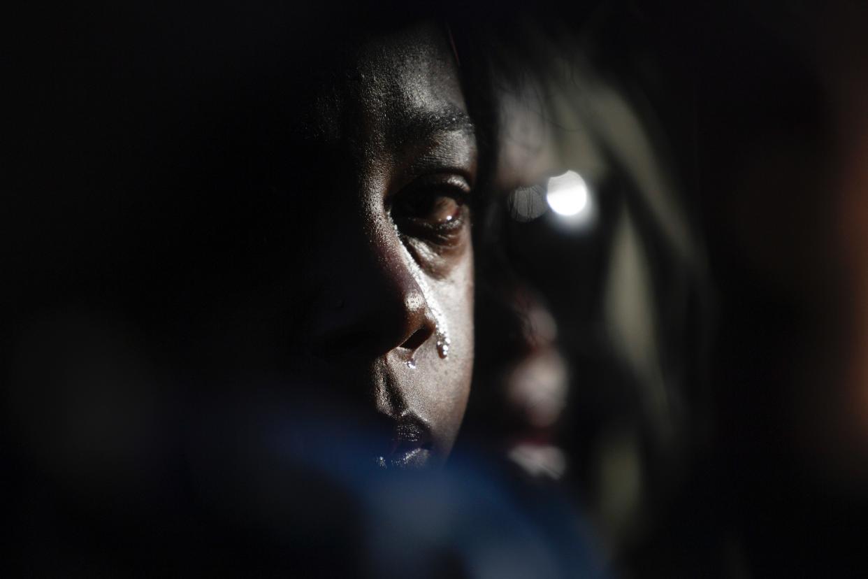 Daijah Fuqua, niece of Covenant School shooting victim Mike Hill, cries during the Nashville Remembers candlelight vigil to mourn and honor the victims of The Covenant School mass shooting at Public Square Park Wednesday, March 29, 2023 in Nashville, Tenn.