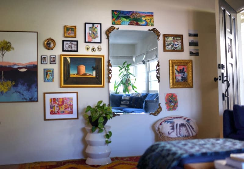 gallery wall and mirror in white living room