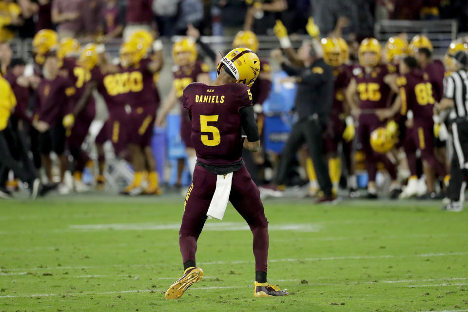 Arizona State quarterback Jayden Daniels (5) reacts toward the bench after throwing for an 81-yard touchdown against Oregon during the second half of an NCAA college football game Saturday, Nov. 23, 2019, in Tempe, Ariz. Arizona State won 31-28. (AP Photo/Matt York)