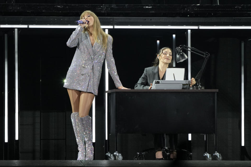 Taylor Swift, left, performs during the opener of her Eras tour Friday, March 17, 2023, at State Farm Stadium in Glendale, Ariz. (AP Photo/Ashley Landis)