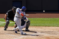 New York Mets' Robinson Cano hits a two-run home run against the New York Yankees during the fifth inning of the first baseball game of a doubleheader, Sunday, Aug. 30, 2020, in New York. (AP Photo/Adam Hunger)