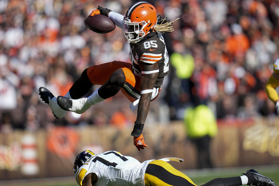 Cleveland Browns tight end David Njoku (85) leaops over Pittsburgh Steelers safety Trenton Thompson (17) during the first half of an NFL football game, Sunday, Nov. 19, 2023, in Cleveland. (AP Photo/Sue Ogrocki)