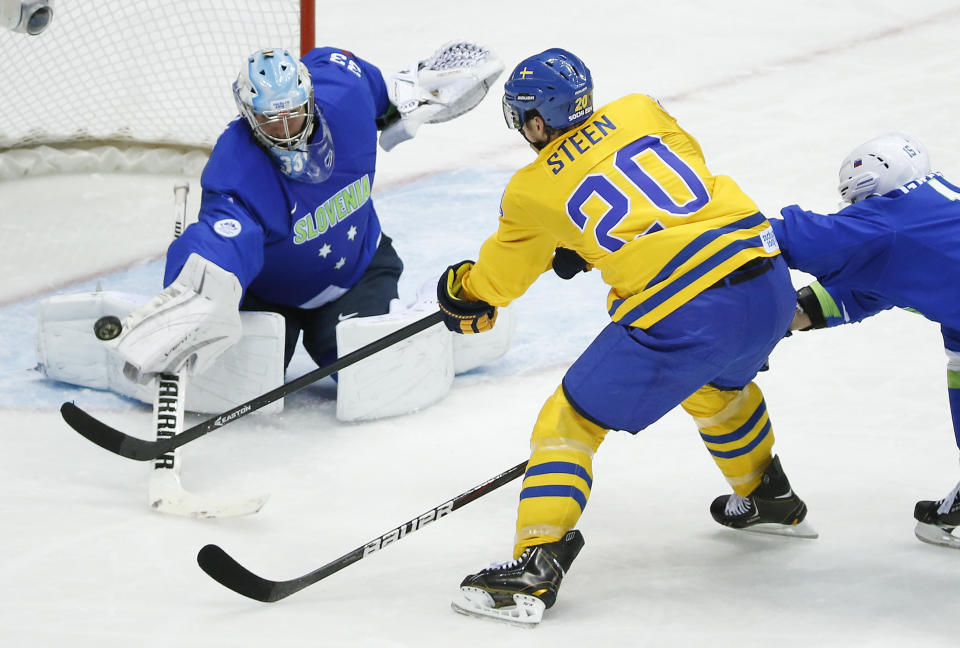 Sweden forward Alexander Steen takes a shot on goal against Slovenia goaltender Robert Kristan in the second period of a men's quarterfinal ice hockey game at the 2014 Winter Olympics, Wednesday, Feb. 19, 2014, in Sochi, Russia. (AP Photo/Mark Humphrey)