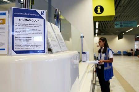 Information for Thomas Cook passengers is placed in front of a counter at Chania Airport after Thomas Cook, the world's oldest travel firm collapsed