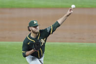 Oakland Athletics starting pitcher Cole Irvin throws in the first inning against the Texas Rangers in a baseball game Tuesday, June 22, 2021, in Arlington, Texas. (AP Photo/Louis DeLuca)