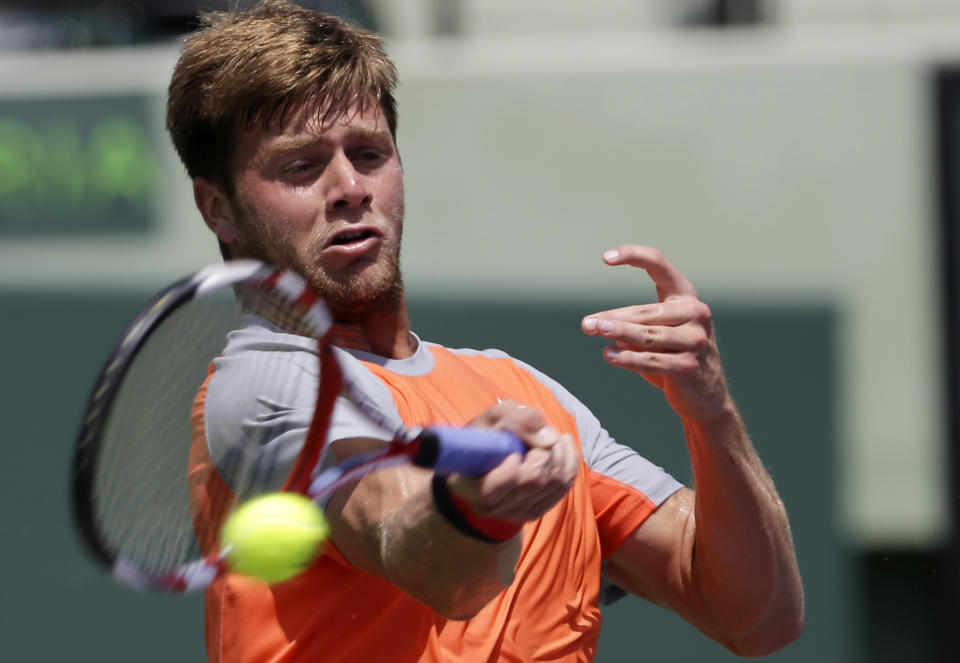 Ryan Harrison returns to Federico Delbonis, of Argentina, at the Sony Open tennis tournament in Key Biscayne, Fla., Thursday, March 20, 2014. (AP Photo/Alan Diaz)