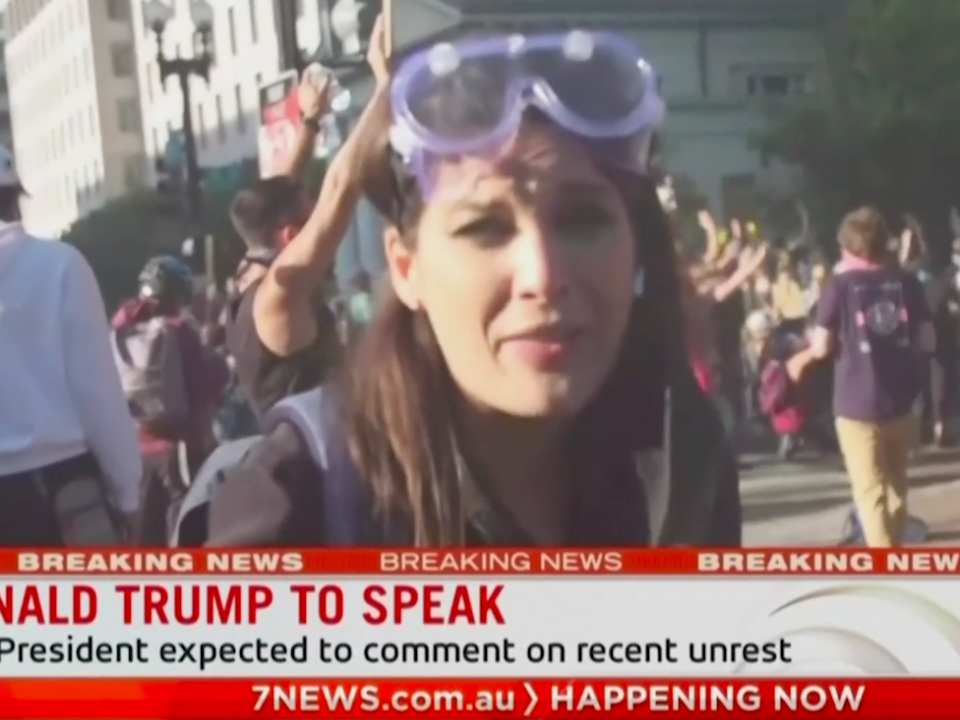 Reporter Amelia Brace reporting from protests in Washington DC, seconds after she and her cameraman were hit by riot plice