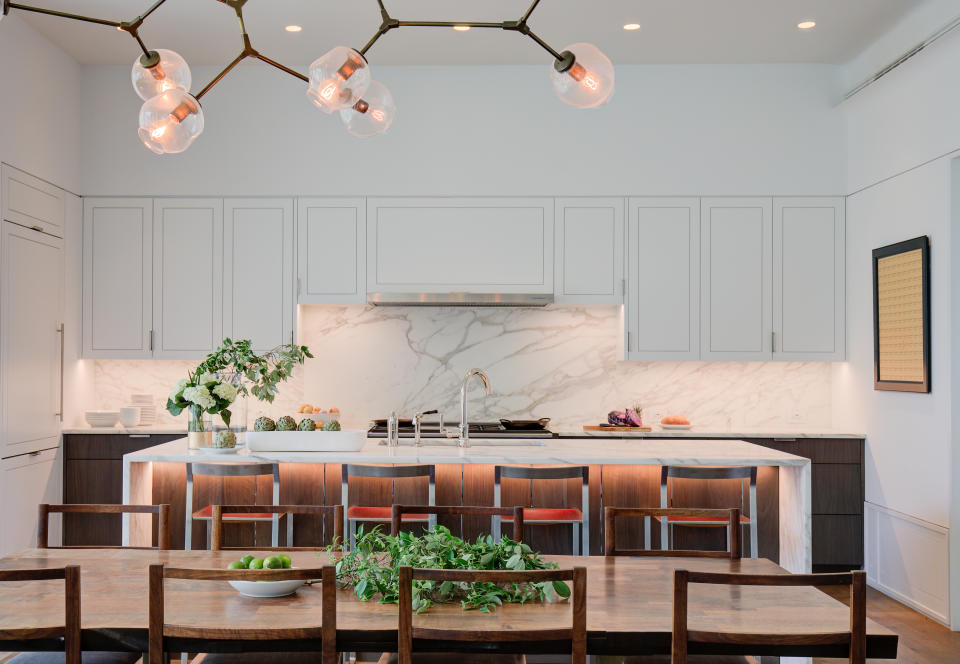 a kitchen island with LED lighting underneath