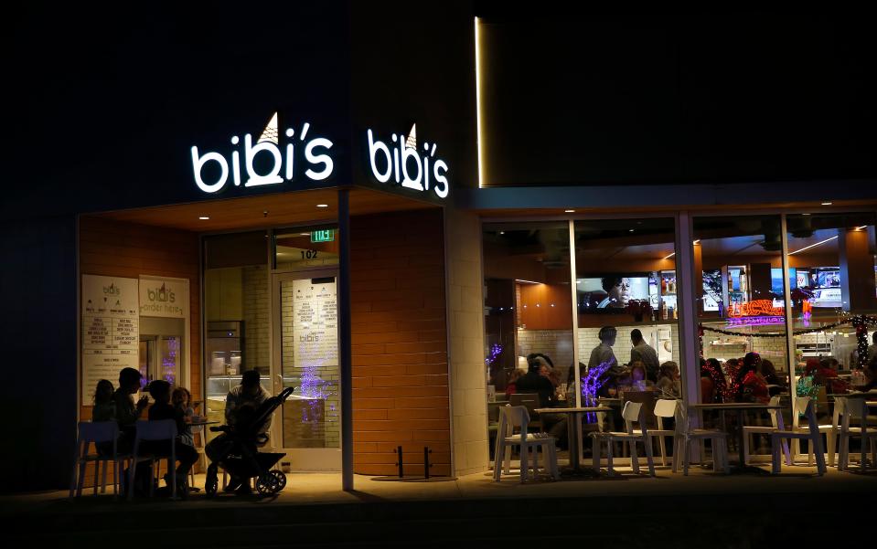 People dine at Bibi's Craft Ice Cream, left, and Birra Birra Craft Pizzeria at Chisholm Creek in Oklahoma City, Tuesday, Dec. 14, 2021. 