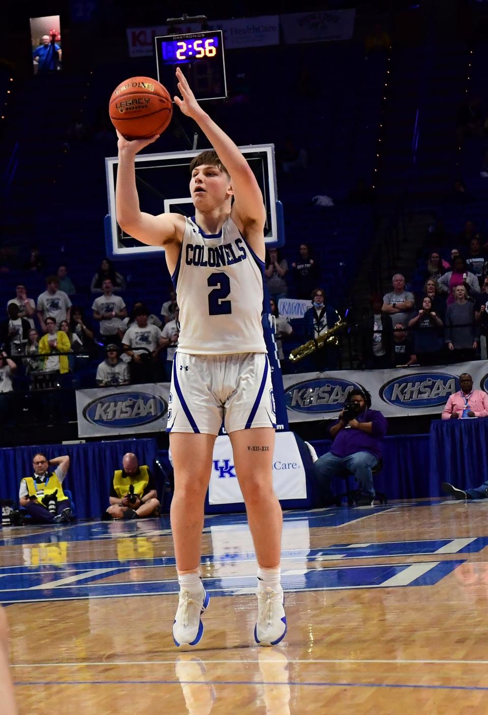 Evan Ipsaro eyes a three-point basket for Covington Catholic in the boys basketball KHSAA state Final Four at Rupp Arena, March 19, 2022.