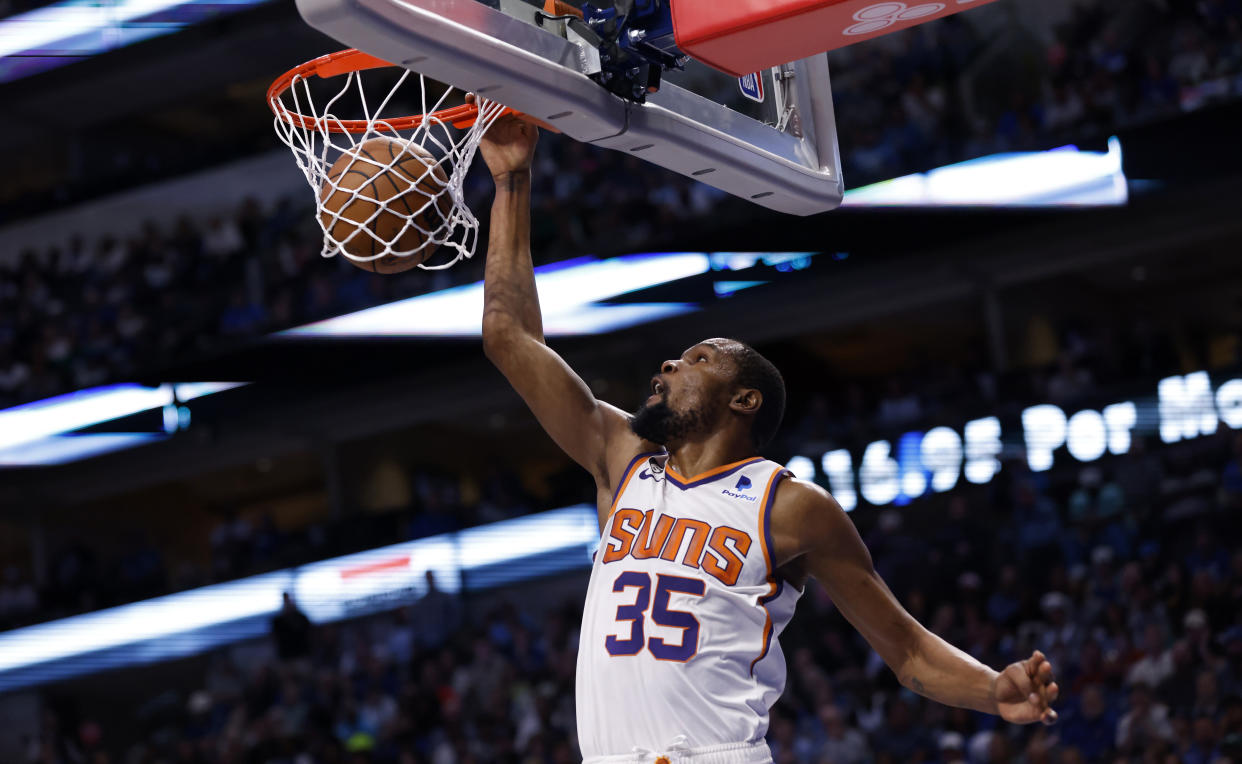 DALLAS, TX - MARCH 5: Kevin Durant #35 of the Phoenix Suns slam dunks against the Dallas Mavericks in the second half at American Airlines Center on March 5, 2023 in Dallas, Texas. The Suns won 130-126. NOTE TO USER: User expressly acknowledges and agrees that, by downloading and or using this photograph, User is consenting to the terms and conditions of the Getty Images License Agreement. (Photo by Ron Jenkins/Getty Images)