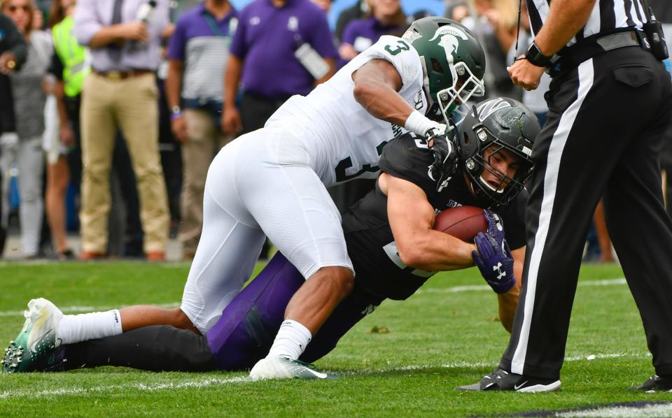 Sep 21, 2019; Evanston, IL, USA; Michigan State Spartans safety Xavier Henderson (3) stops Northwestern Wildcats running back Isaiah Bowser (25) at the one yard line during the first half at Ryan Field. Mandatory Credit: Matt Marton-USA TODAY Sports