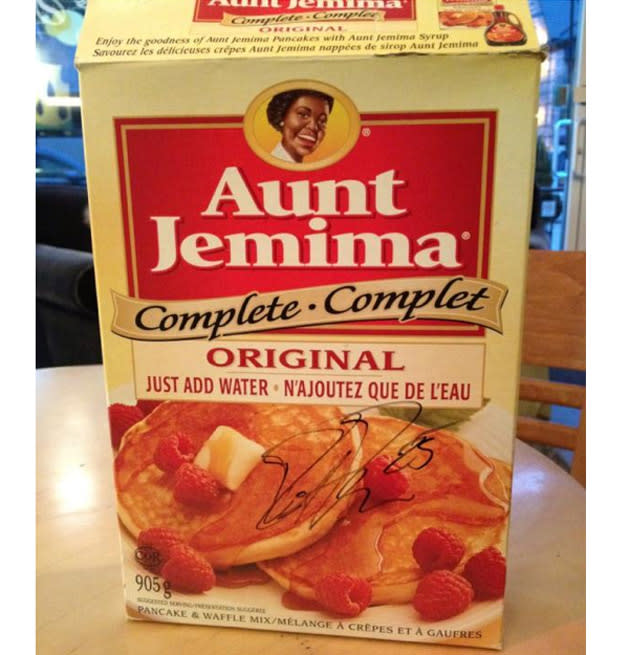 Pancakes fan Dustin Penner autographed box of Aunt Jemima; there's syrup  behind Kings bench