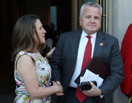 Canada's Minister of Foreign Affairs Chrystia Freeland shakes hands with U.S. Acting Secretary of State John J. Sullivan prior to a reception at the Royal Ontario Museum on the first day of meetings for foreign ministers from G7 countries in Toronto, Ontario, Canada April 22, 2018. REUTERS/Fred Thornhill