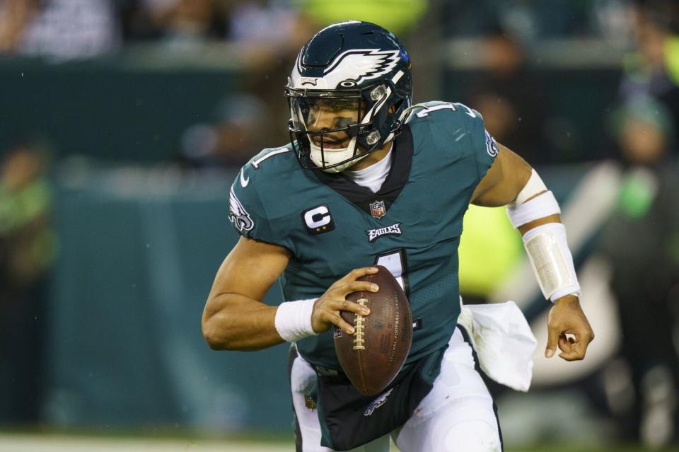 Eagles quarterback Jalen Hurts rolls out during Philadelphia's win in the NFC championship game Jan. 29, 2023.