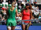 Tennis - Pan Pacific Open Women's Singles Final match - Ariake Coliseum, Tokyo, Japan - 25/09/16. Caroline Wozniacki of Denmark shakes hands with Naomi Osaka of Japan after their final match. REUTERS/Issei Kato