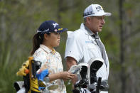 Nasa Hataoka, of Japan, left, stands with her caddie on the eighth tee during the second round of the LPGA CME Group Tour Championship golf tournament, Friday, Nov. 18, 2022, at the Tiburón Golf Club in Naples, Fla. (AP Photo/Lynne Sladky)