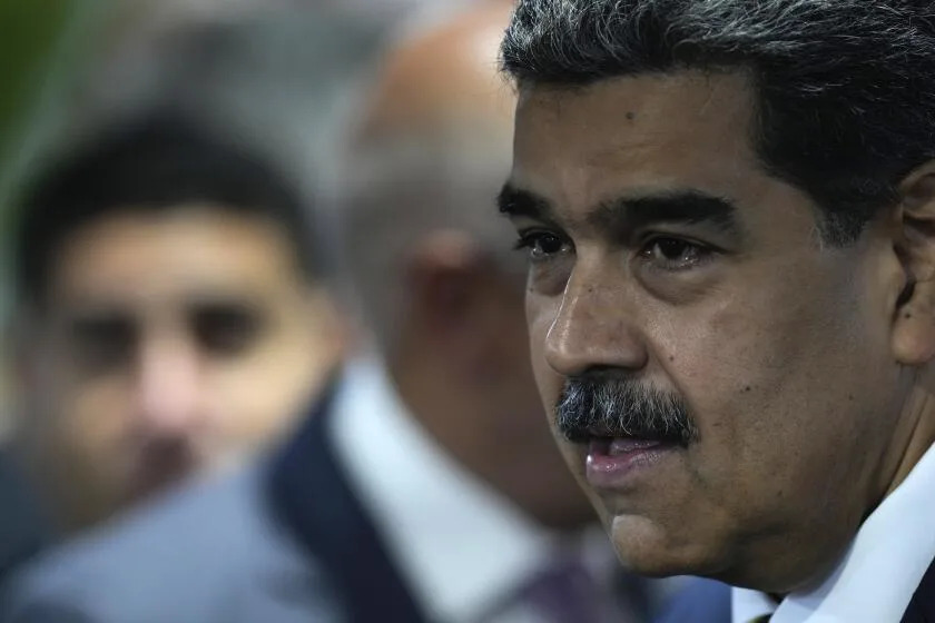 Venezuelan President Nicolas Maduro attends a signing an agreement to respect the results of the upcoming presidential elections, at the National Electoral Council headquarters in Caracas, Venezuela, Thursday, June 20, 2024. (AP Photo/Ariana Cubillos)