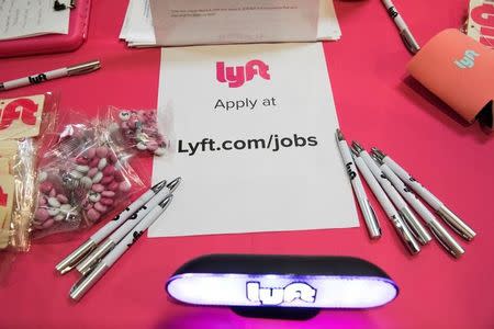 The Lyft booth is seen at TechFair in Los Angeles, California, U.S. March 8, 2018. REUTERS/Monica Almeida - RC1EF3027A50