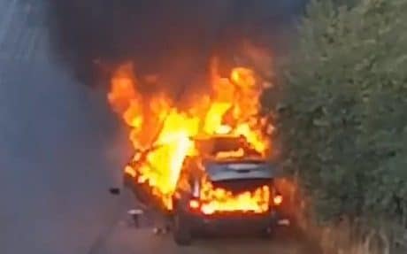 A car burns after fresh explosions in Beirut