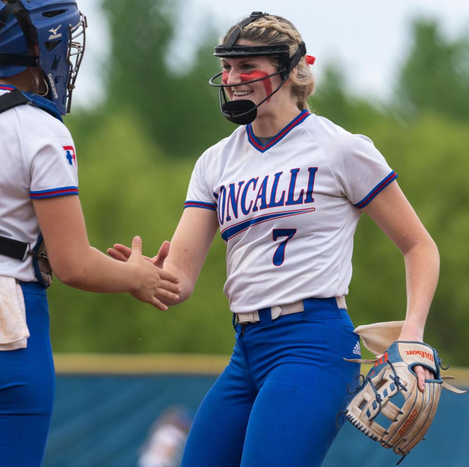 Roncalli High School pitcher Keagan Rothrock (7) is greeted by catcher Roncalli High School's Anne Marie Meek (16) after a strike out, Wednesday, May 25, 2022, at the 4A sectional softball final won by Roncalli 10-0. 