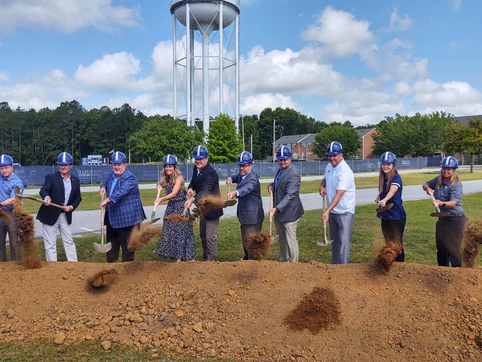 Dirt goes flying during the groundbreaking ceremony for the Anthony P. Tippins Family Indoor Practice Facility to be constructed next to Paulson Stadium on the Georgia Southern University campus in Statesboro.