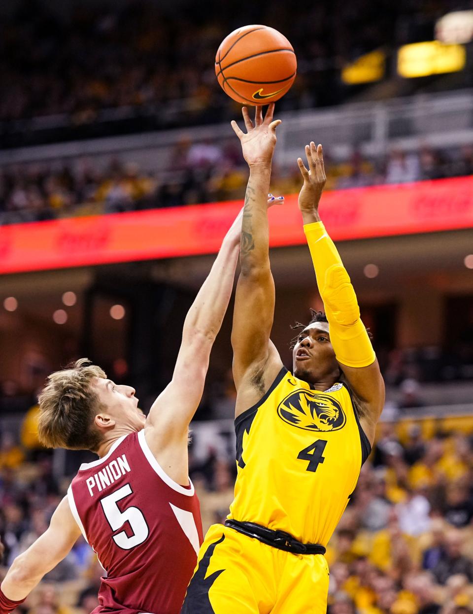 Missouri Tigers guard DeAndre Gholston (4) shoots against Arkansas Razorbacks guard Joseph Pinion (5) during the first half at Mizzou Arena on Jan. 18, 2023 in Columbia, Missouri.