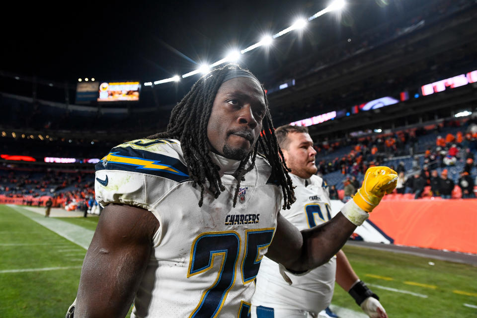 DENVER, CO - DECEMBER 1:  Melvin Gordon #25 and Scott Quessenberry #61 of the Los Angeles Chargers walk off the field after a 23-20 loss to the Denver Broncos at Empower Field at Mile High on December 1, 2019 in Denver, Colorado.  (Photo by Dustin Bradford/Getty Images)