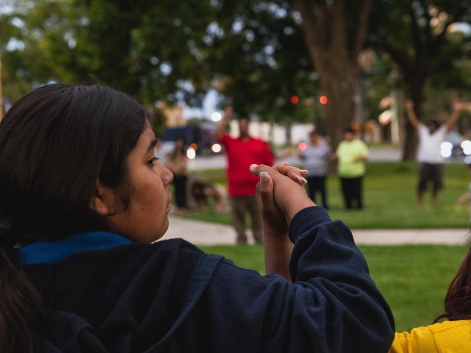 Members of the community gather at the City of Uvalde Town Square for a prayer vigil in the wake of a mass shooting at Robb Elementary School on May 24, 2022 in Uvalde, Texas.