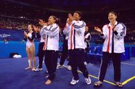 <b>2000 Sydney Olympics</b><br>19 Sep 2000: Tasha Schwikert-Warren (left), Dominique Dawes (centre) and Amy Chow (right) of the USA celebrate their fourth place in the Womens Team Gymnastics Final on Day Four of the Sydney 2000 Olympic Games in Sydney, Australia. Mandatory Credit:Billy Stickland/ALLSPORT