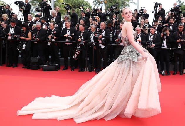 Fanning sporting an Alexander McQueen gown for the opening night of the 76th Cannes Film Festival.