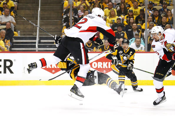 PITTSBURGH, PA - MAY 15: Dion Phaneuf #2 of the Ottawa Senators hits Bryan Rust #17 of the Pittsburgh Penguins during the first period in Game Two of the Eastern Conference Final during the 2017 NHL Stanley Cup Playoffs at PPG PAINTS Arena on May 15, 2017 in Pittsburgh, Pennsylvania. (Photo by Gregory Shamus/Getty Images)