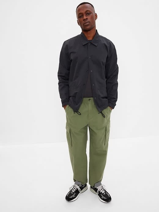 olive green gap relaxed taper cargo pant with black jacket