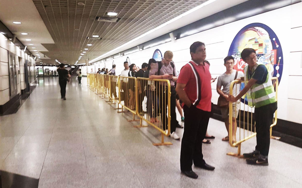 Commuters queueing for the shuttle bus service towards Jurong East Station at Outram Park Station. PHOTO: Wan Ting Koh/Yahoo News Singapore