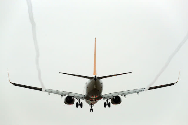 File photo dated 19/12/16 of a plane landing at Gatwick Airport in West Sussex as more than 4.5 million people will head abroad from the UK over Christmas and New Year, new figures show.