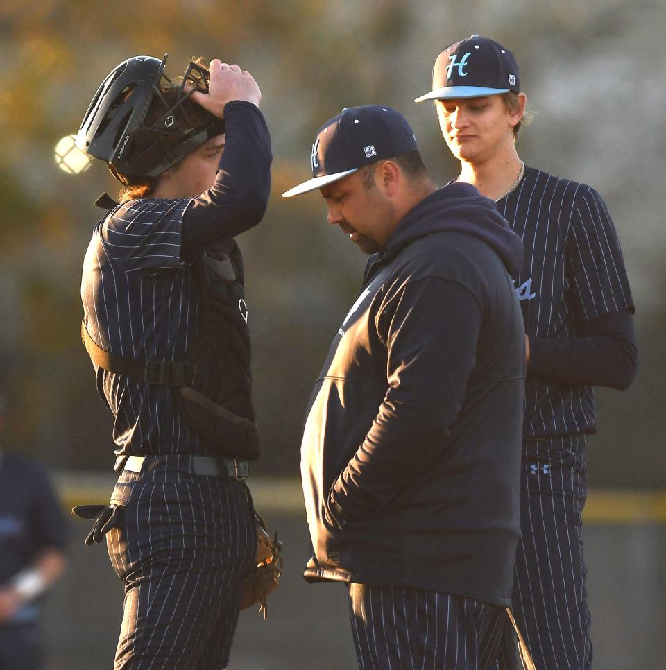 Hoggard's Coach Bryan Tuck talks to his players as Hoggard took on Ashley Tuesday March 19, 2024 at Ashley High School. Hoggard won 4-2 to remain unbeaten. KEN BLEVINS/STARNEWS