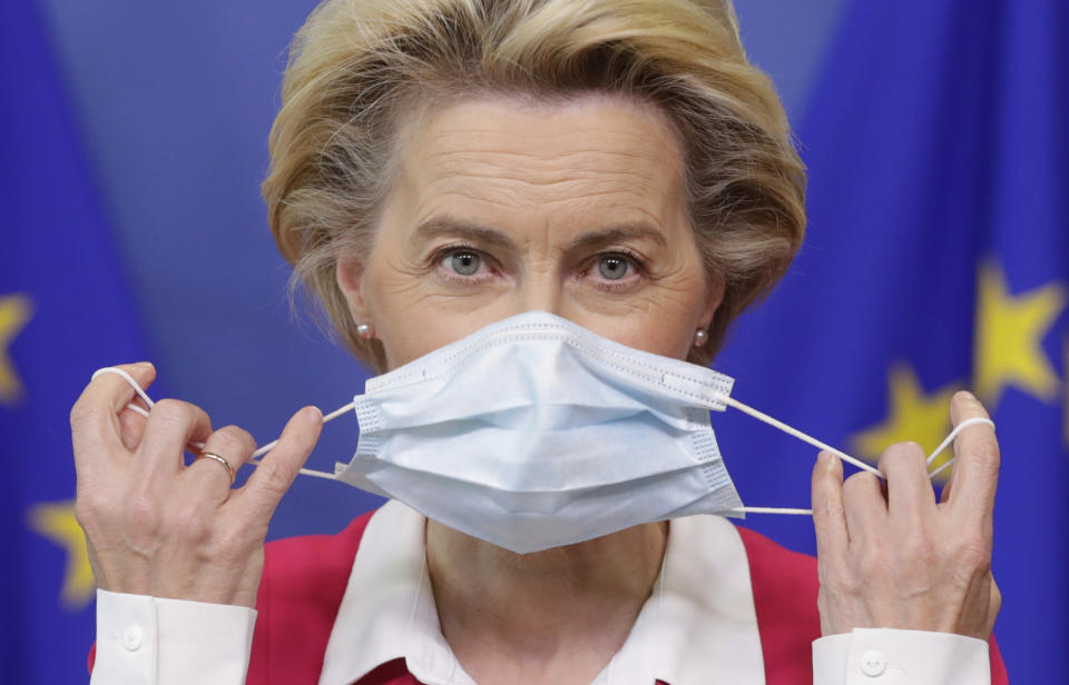 European Commission President Ursula von der Leyen removes her face mask before giving a statement at the European Commission headquarters in Brussels, Wednesday, Sept. 23, 2020. (Stephanie Lecocq/Pool Photo via AP)