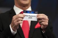 Football Soccer - UEFA Champions League Semi-Final Draw - Nyon, Switzerland - 21/4/17 Final Ambassador Ian Rush holds the name of Real Madrid during the draw of the UEFA Champions League semi-finals Reuters / Pierre Albouy Livepic