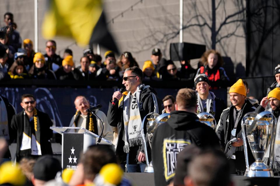 Crew goalkeeper Evan Bush talks to fans at Columbus' victory rally in Chase Plaza outside of Lower.com Field on Tuesday.