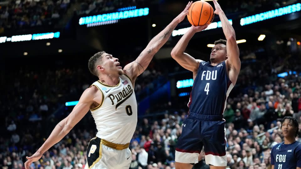 FDU guard Grant Singleton shoots during one of the all-time March Madness upsets. - Paul Sancya/AP