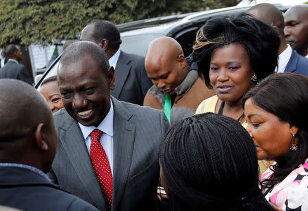 Kenya's Deputy President William Ruto greets people at the IEBC National Tallying centre at the Bomas of Kenya, in Nairobi, Kenya August 11, 2017. REUTERS/Thomas Mukoya