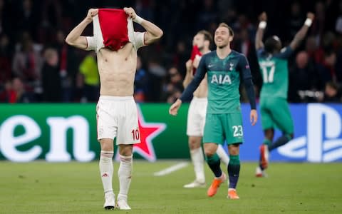 Dusan Tadic covers his face after Ajax's agonising defeat to Tottenham - Credit: getty images